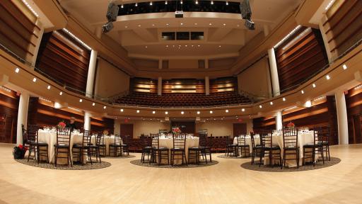 Wentz Concert Hall filled with dinner tables.