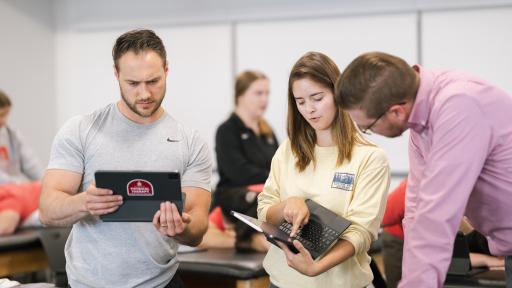 North Central College Doctor of Physical Therapy students working with one another.