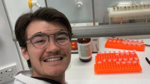 A selfies of Ian LaPat in a lab on campus.