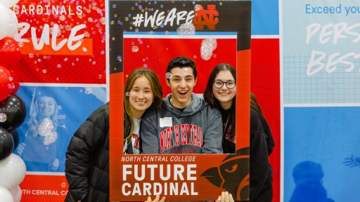 Future students are posing for a photo at Admitted Student Day.