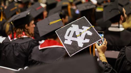 A decorated grad cap at Commencement 2025.