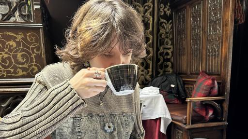 Mischa drinking coffee