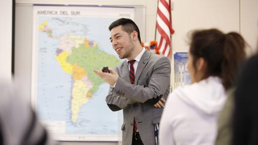 Professor standing in front of map