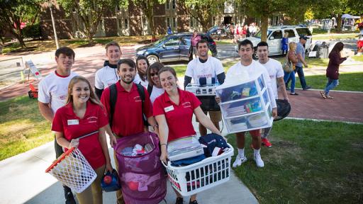 Student ambassadors helping new freshmen move into their dorms.