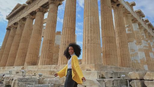 Student posing in front of the Parthenon 