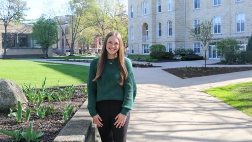 Student standing outside Old Main