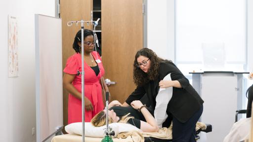 OT student with patient and instructor
