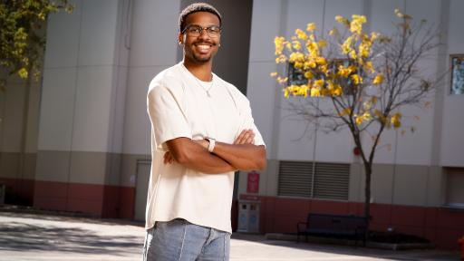 Student standing outside athletic center