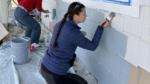 Students painting a home for Habitat for Humanity