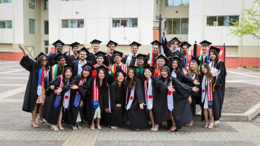 students with international stoles at graduation