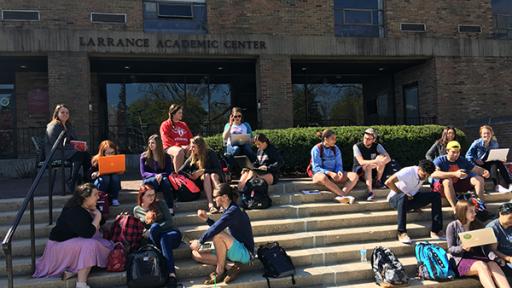 Students sitting on the steps of the Larrance Academic Center.