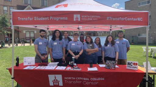 Transfer students at outdoor booth