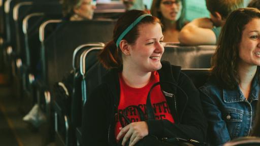 students riding the metra train