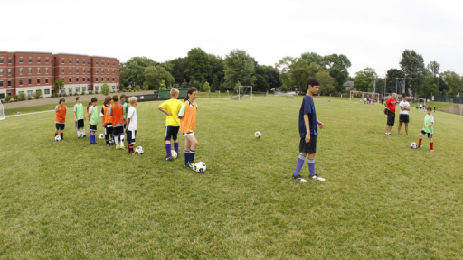 Kids playing soccer on Grass Practice Field