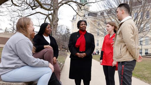 Dr. Anita Thomas, president of North Central College, talking with students.