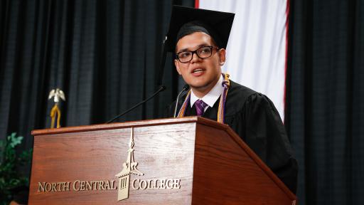 International student speaking at graduation