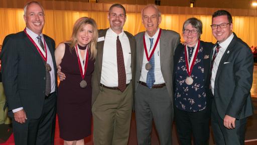 North Central College honored donors wearing medals.